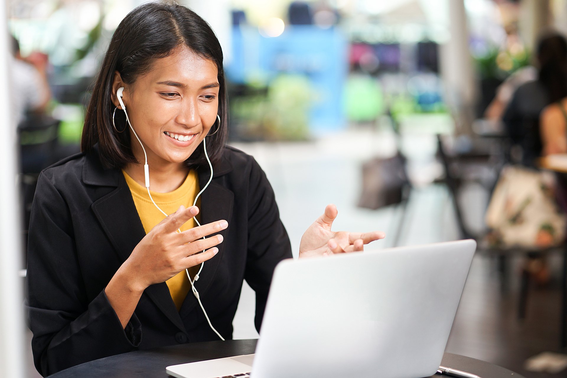 A woman on a video call on her laptop